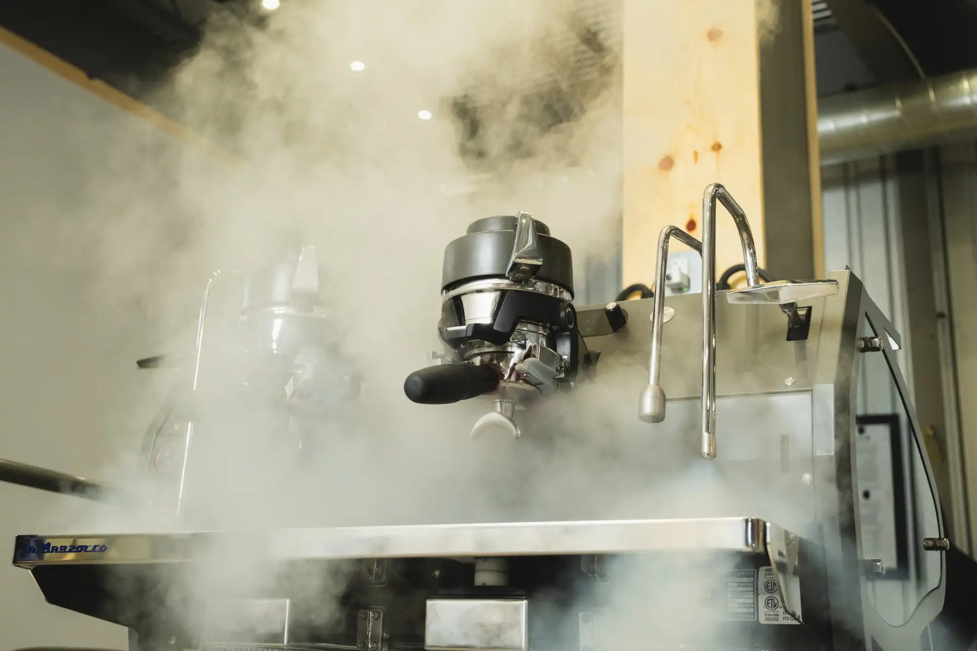 Barista crafting espresso at the Loops espresso counter